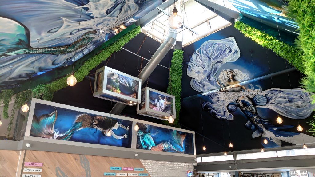 Commercial restaurant mural designed and painted by Urban Gypset mural artists for interior design