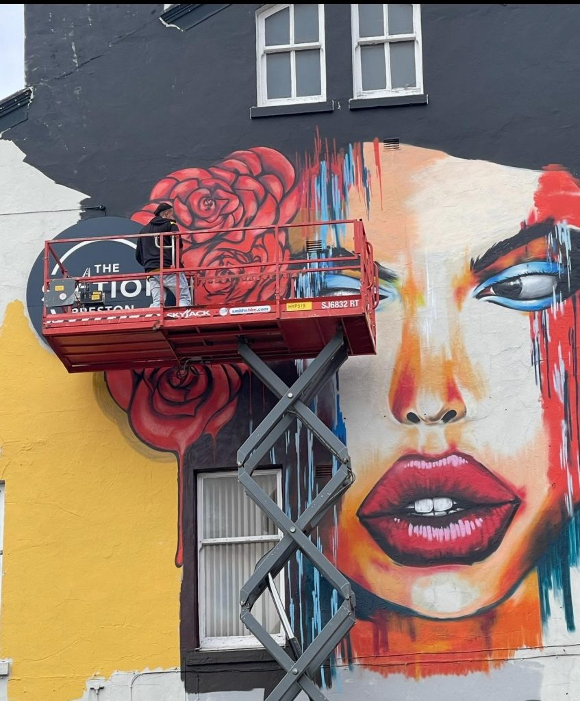 Large-scale exterior mural painted by a professional mural artist