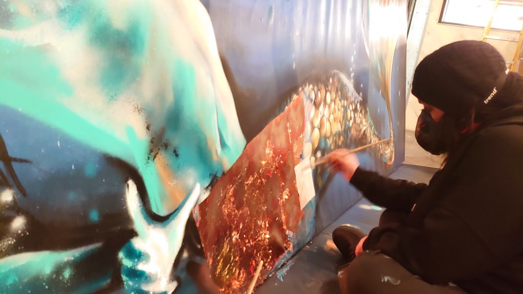 restaurant mural artist devon urban gypsets amanda metal leafing the canvas work of a mermaid