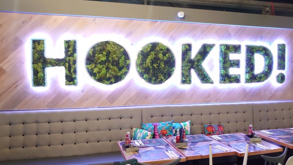 restaurant mural artist devon, urban gypset created a moss leafed lettering for the venue
