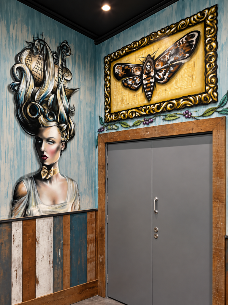 Detailed vintage-style portrait mural inside a Shrewsbury pub